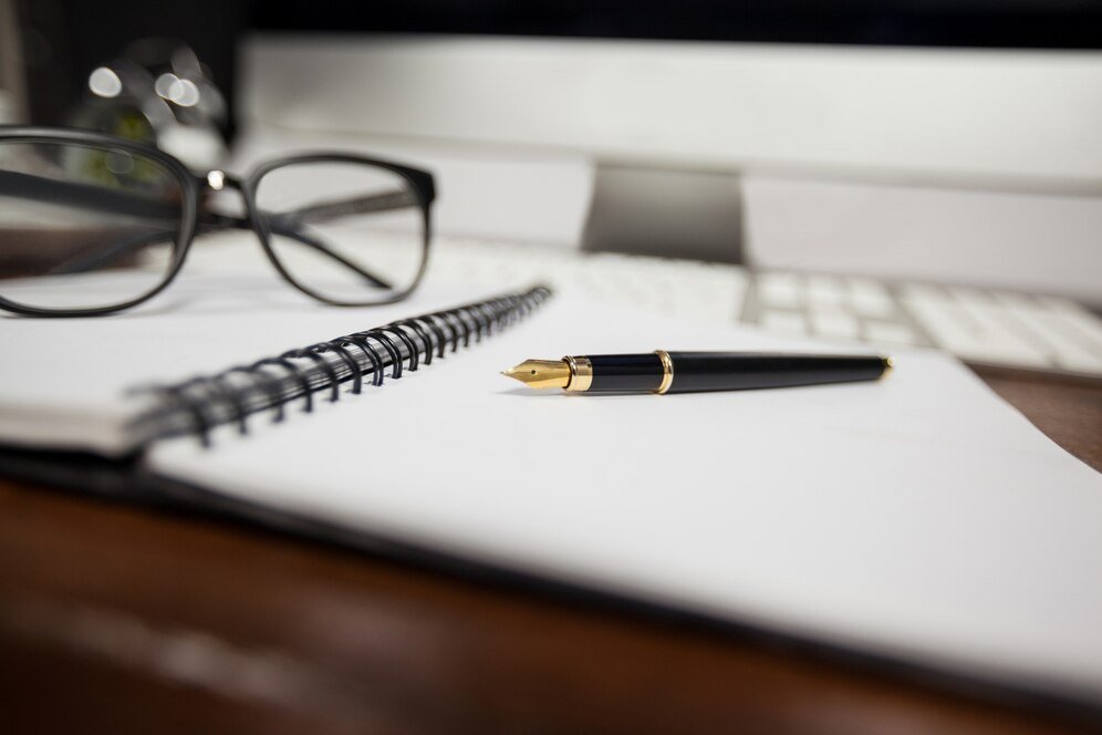 spiral notepad with pen reading glasses 1252 803.jpg